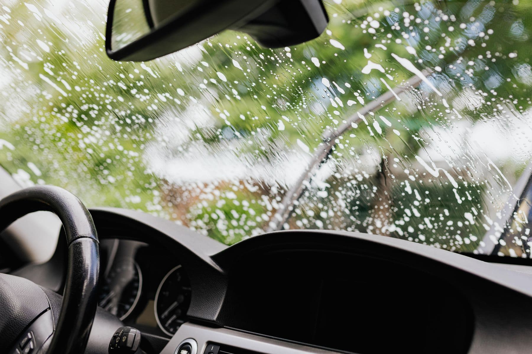 Windscreen seen from inside while the outside glass is cleaned